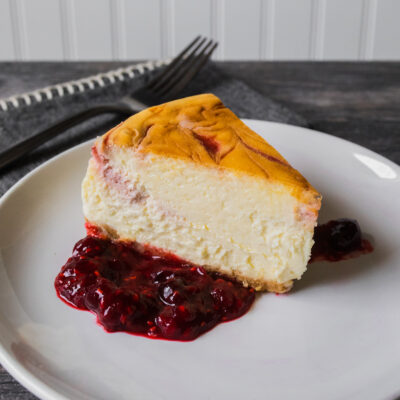 Cranberry Swirl Cheesecake with Cranberry-Raspberry Compote<br>Delivery January 13-17